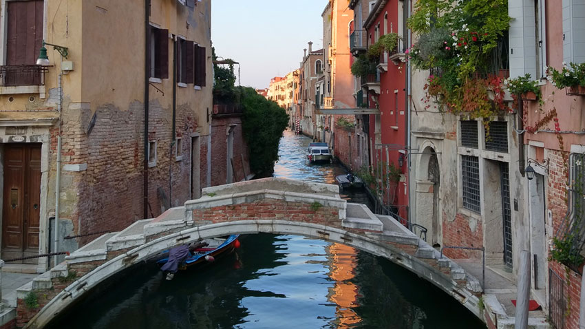 The bridge in Venice where my main character would later sit in silence and ask, 'Do you ever think that the music we listen to is the soundtrack to our lives?'