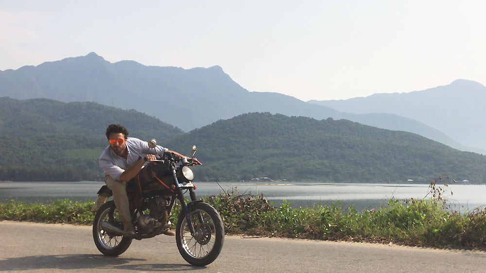 Author writer Joshua Humphreys on Briseis, his Suzuki GN125, in Vietnam. 